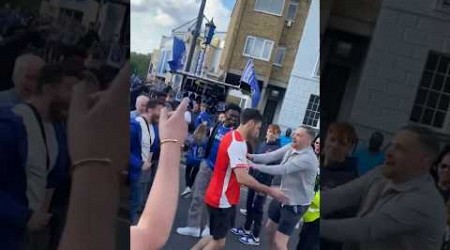 Chelsea fans TAUNT Arsenal supporter outside Stamford Bridge after Gunners miss out on title 