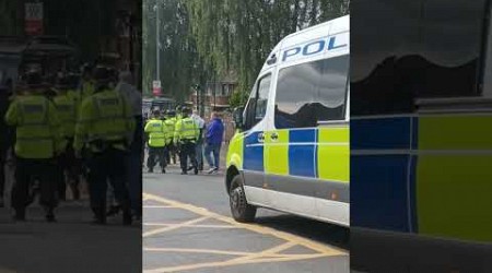 POLICEMAN tells ZULUS to leave MILLWALL fans alone as they protect them in an escort!