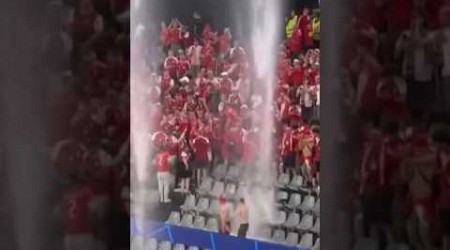 Fans dancing through the crazy thunderstorm at EUROS match Germany vs Denmark