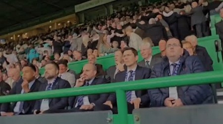 Celtic Fans Do The Huddle In Front Of Depressed Looking Rangers Board