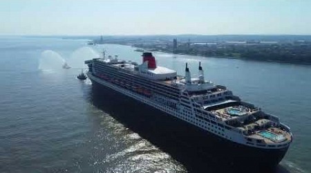 The Queen Mary 2 passes the beautiful new Everton Stadium on a calm, blue, sunlit Mersey 