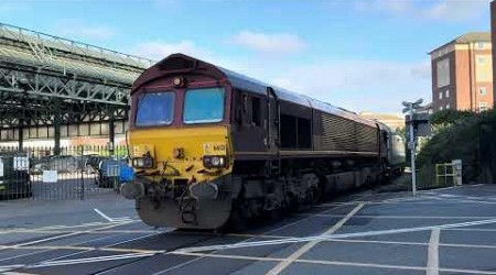 66121 with the BMW mini car train crosses the open level crossing at Canute Road Southampton