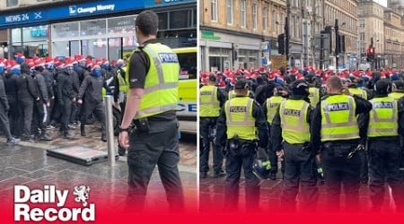 Rangers fans in Santa hats kettled on Union Street before Scottish League Cup Final against Celtic